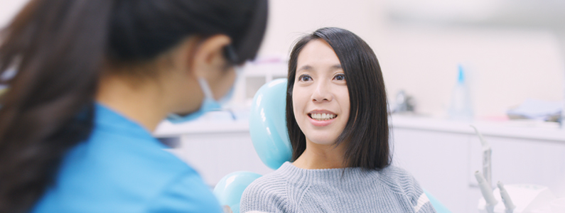 Patient talking with dentist